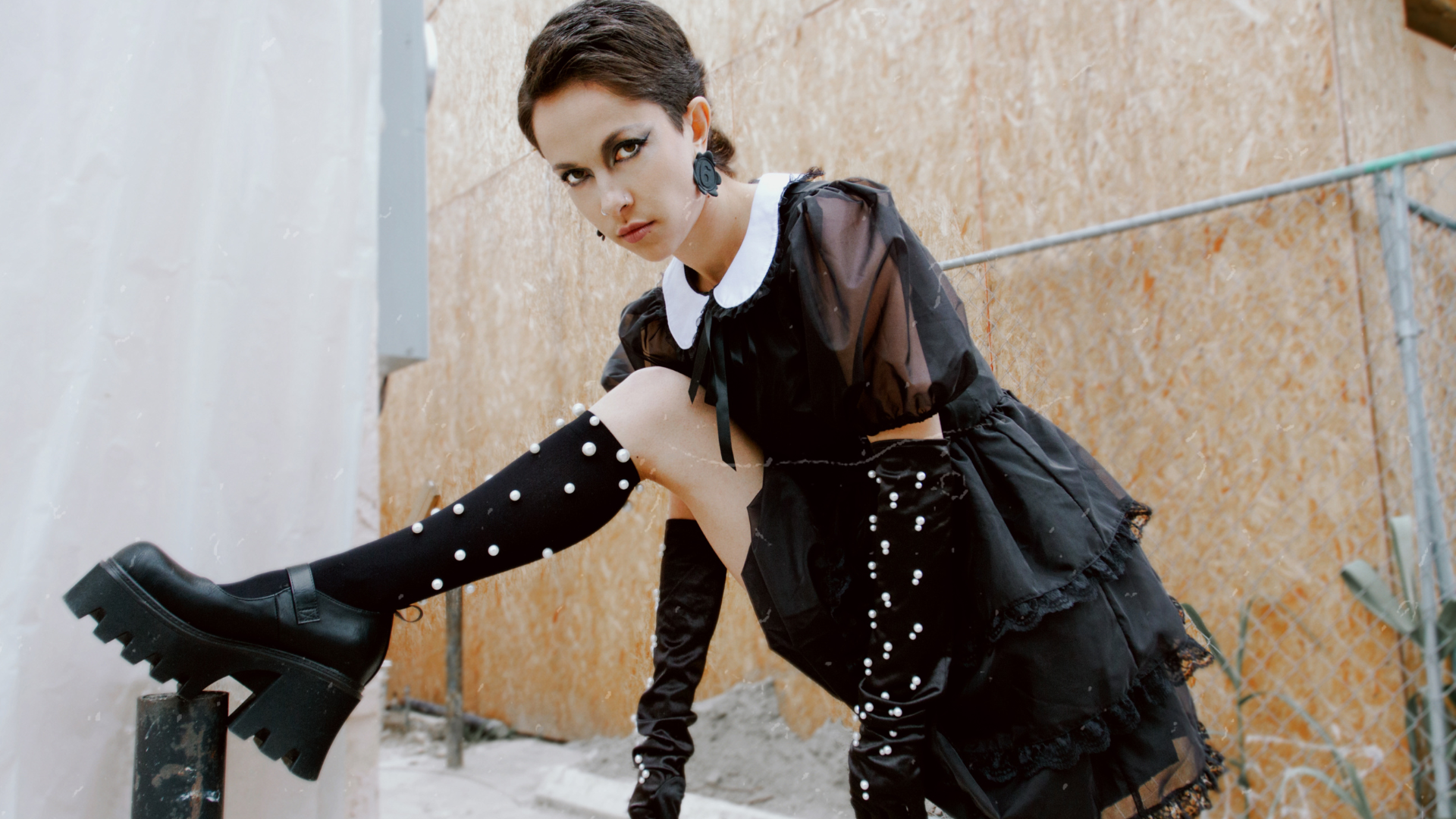 gothic girl with pearl socks and pearl gloves for halloween. Wednesday Addams vibes cosplay